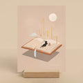 Illustration of a person lying on an open book with a cityscape and moon in the background.