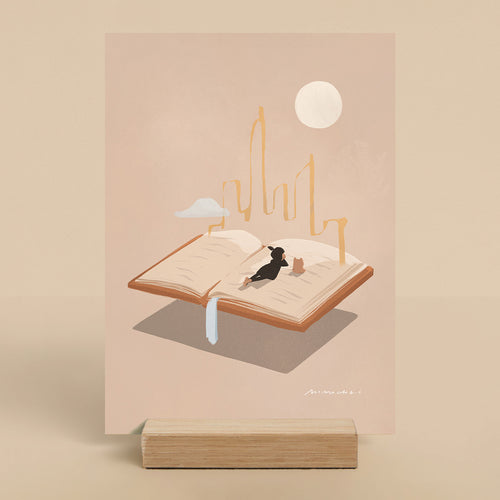 Illustration of a person lying on an open book with a cityscape and moon in the background.