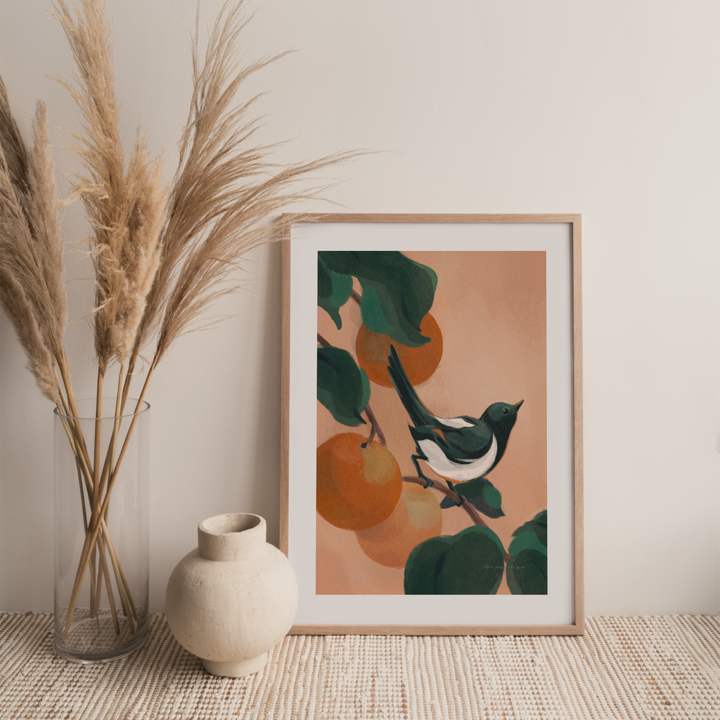 A framed art print featuring a bird perched on a branch with oranges - auspicious artwork for home - Mimochai 