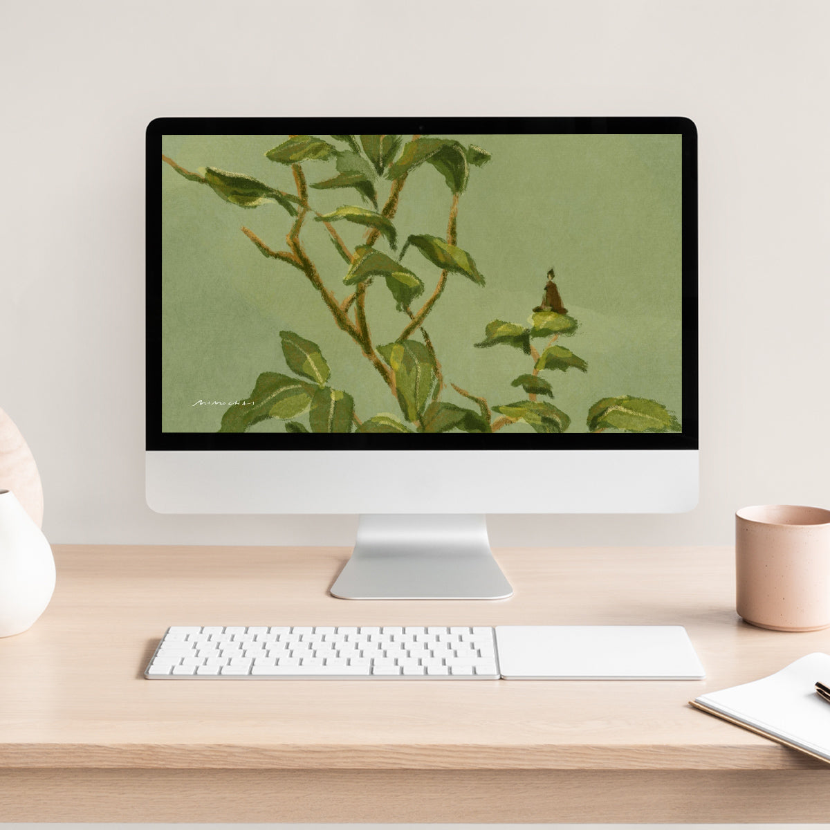 Computer monitor displaying a nature-themed Camellia Leaves wallpaper on a desk with a keyboard and mug.