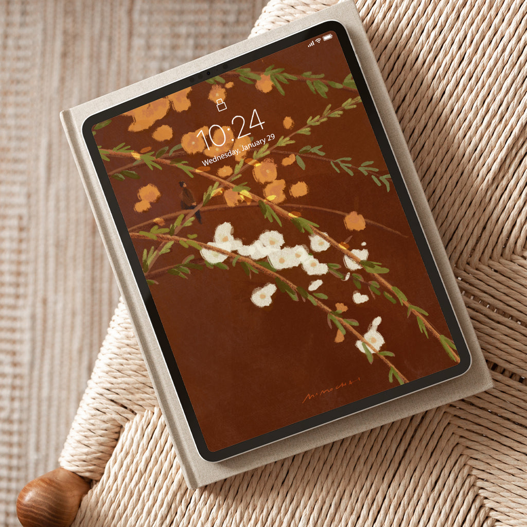Tablet with a floral screen on a textured surface