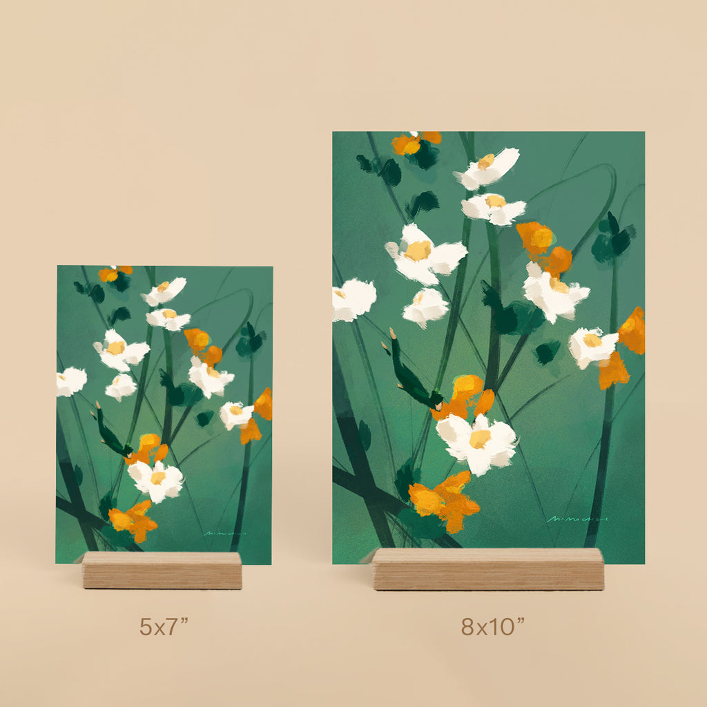 Two floral art prints on stands with dimensions 5x7 and 8x10 on a beige background.