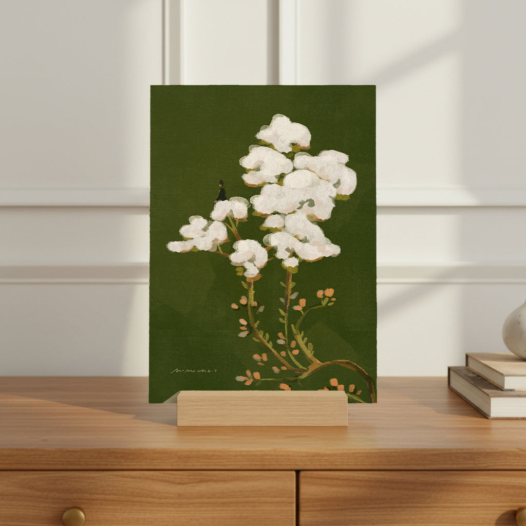 Floral art print on a stand against a white wall