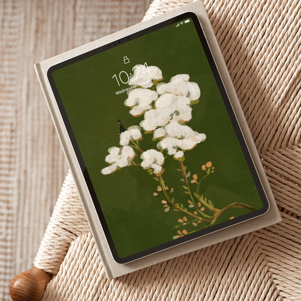 Tablet with a floral screen on a textured surface