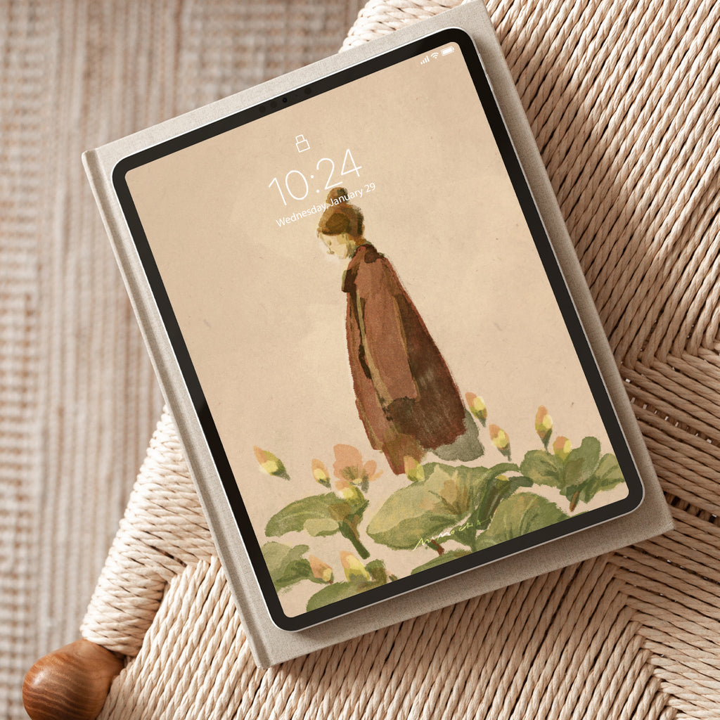 Tablet with a scenic wallpaper on a textured surface