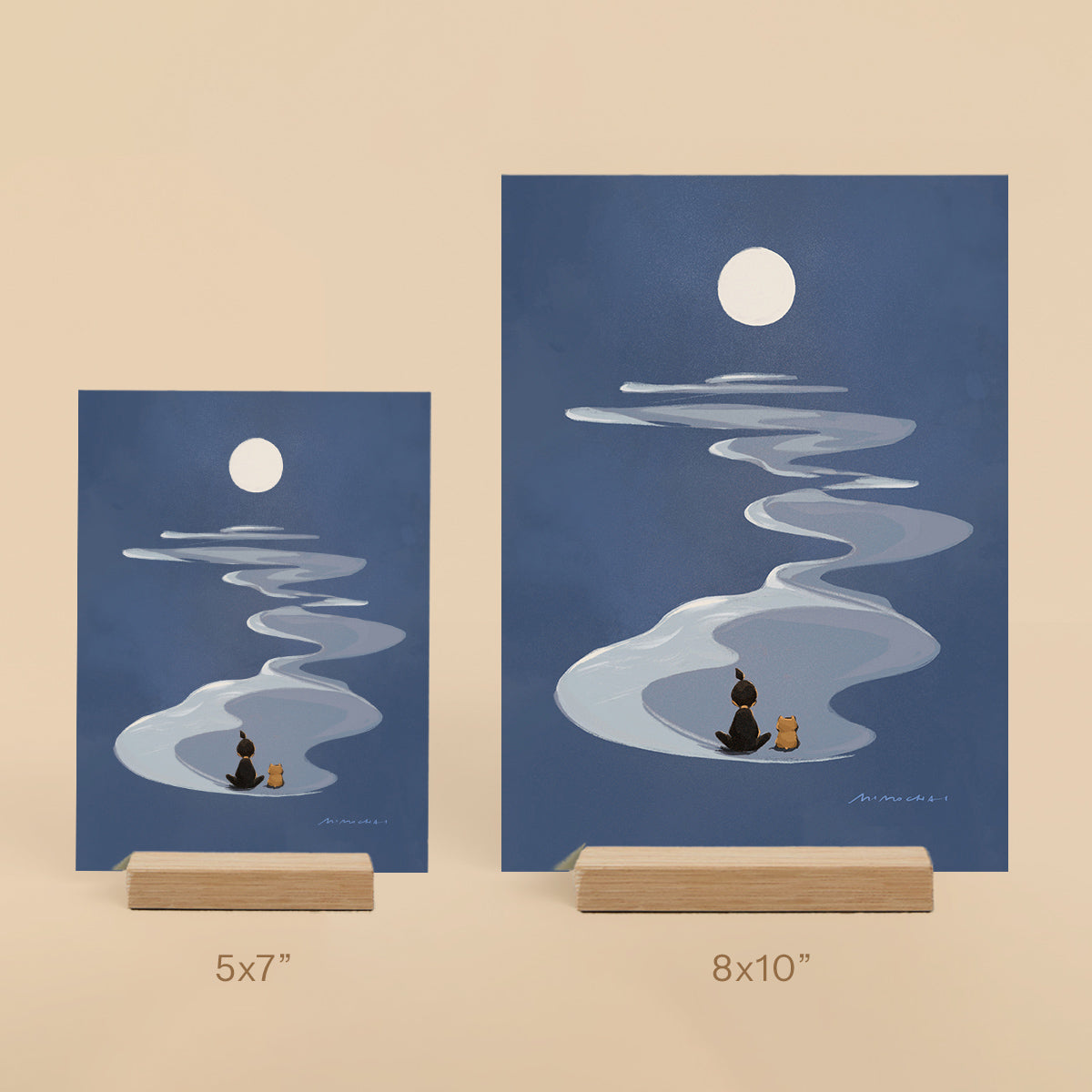 Two framed illustrations of a moonlit scene with people and a dog on a beige background.