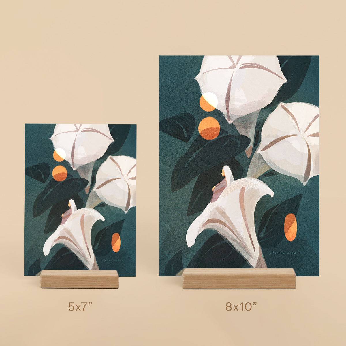 Two floral art prints on stands with dimensions 5x7 and 8x10 on a beige background.