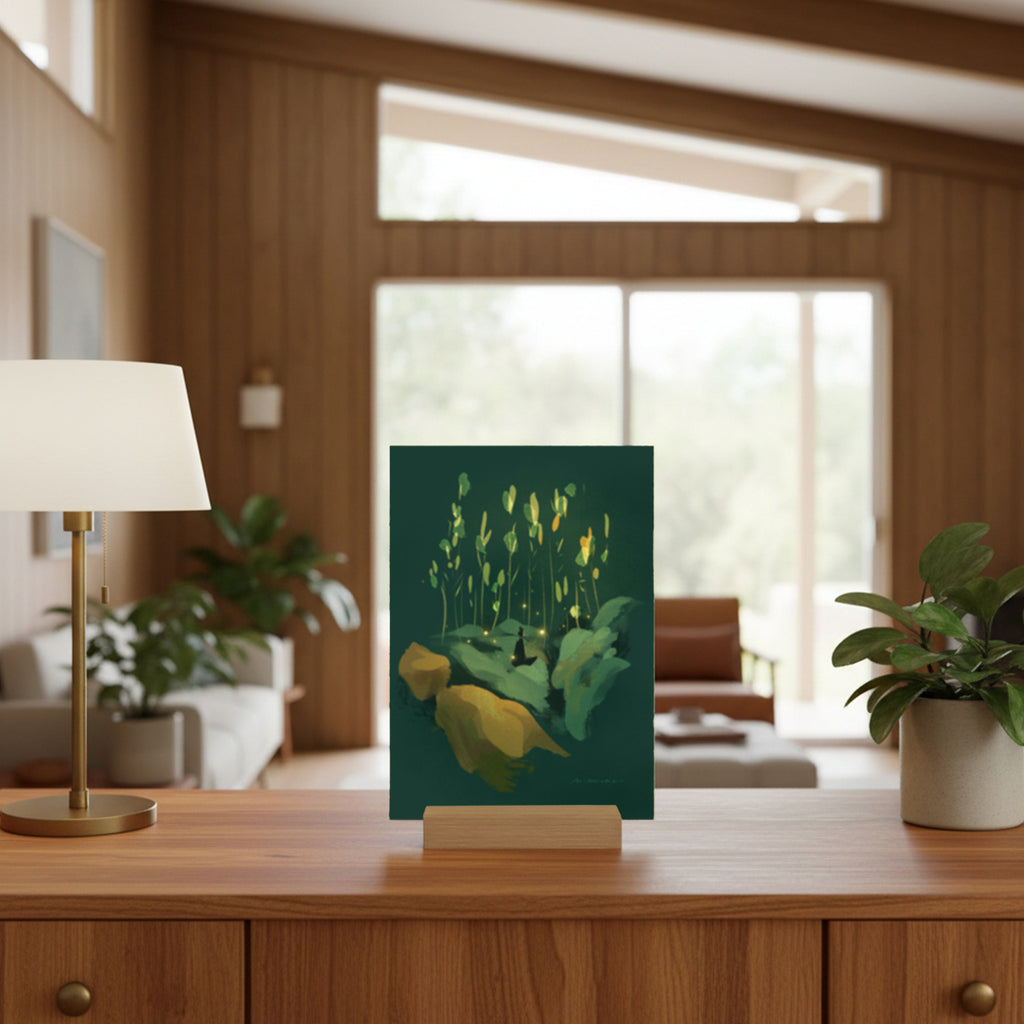 Decorative dark green mini art print on a stand in a living room setting