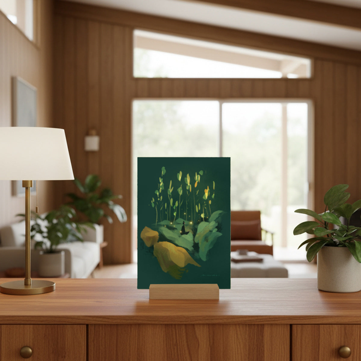 Decorative dark green mini art print on a stand in a living room setting