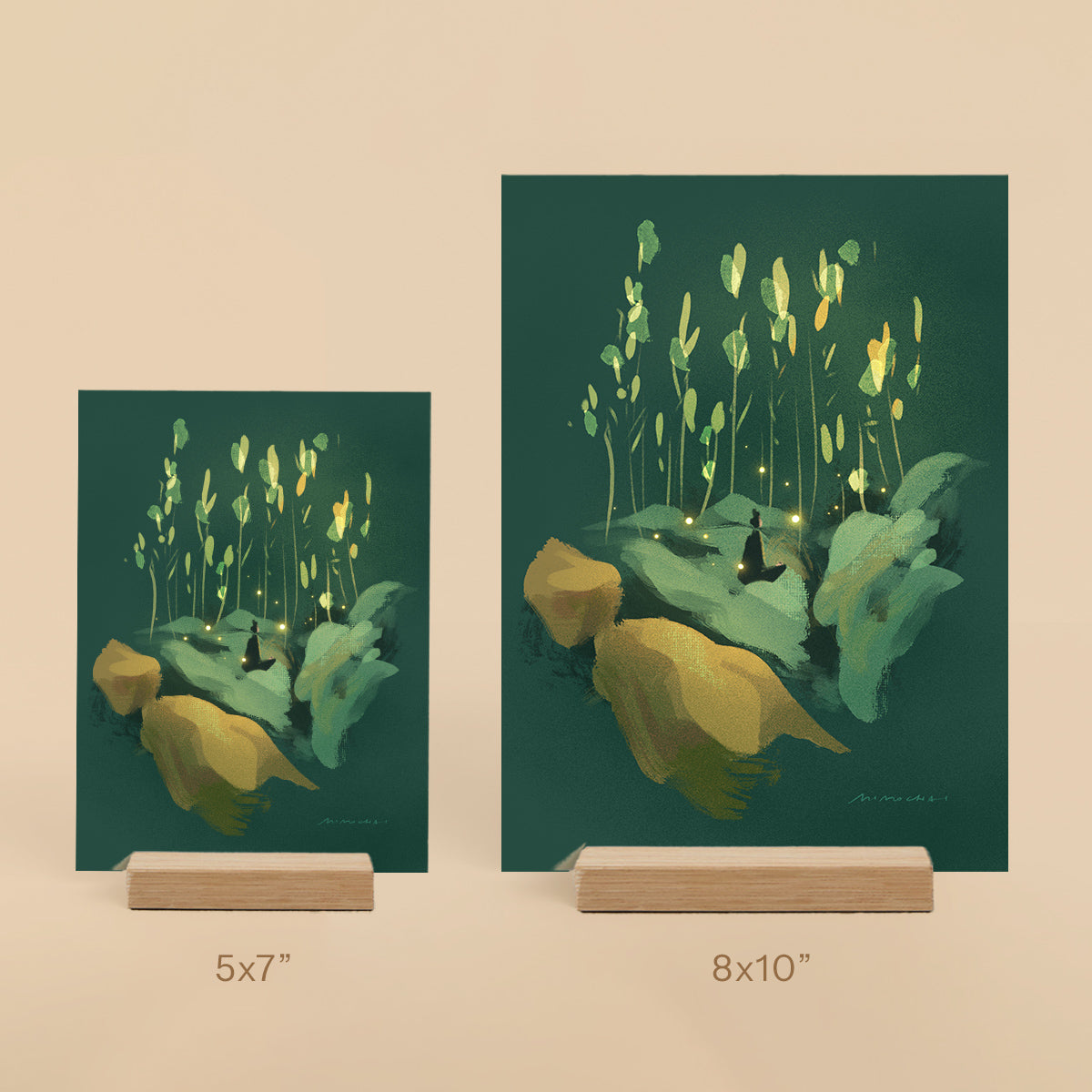 Two framed artworks of nature scenes with glowing elements on a beige background.