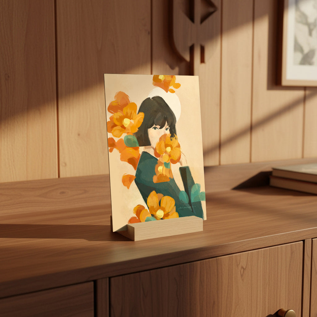 Mini print with a floral illustration on a wooden table