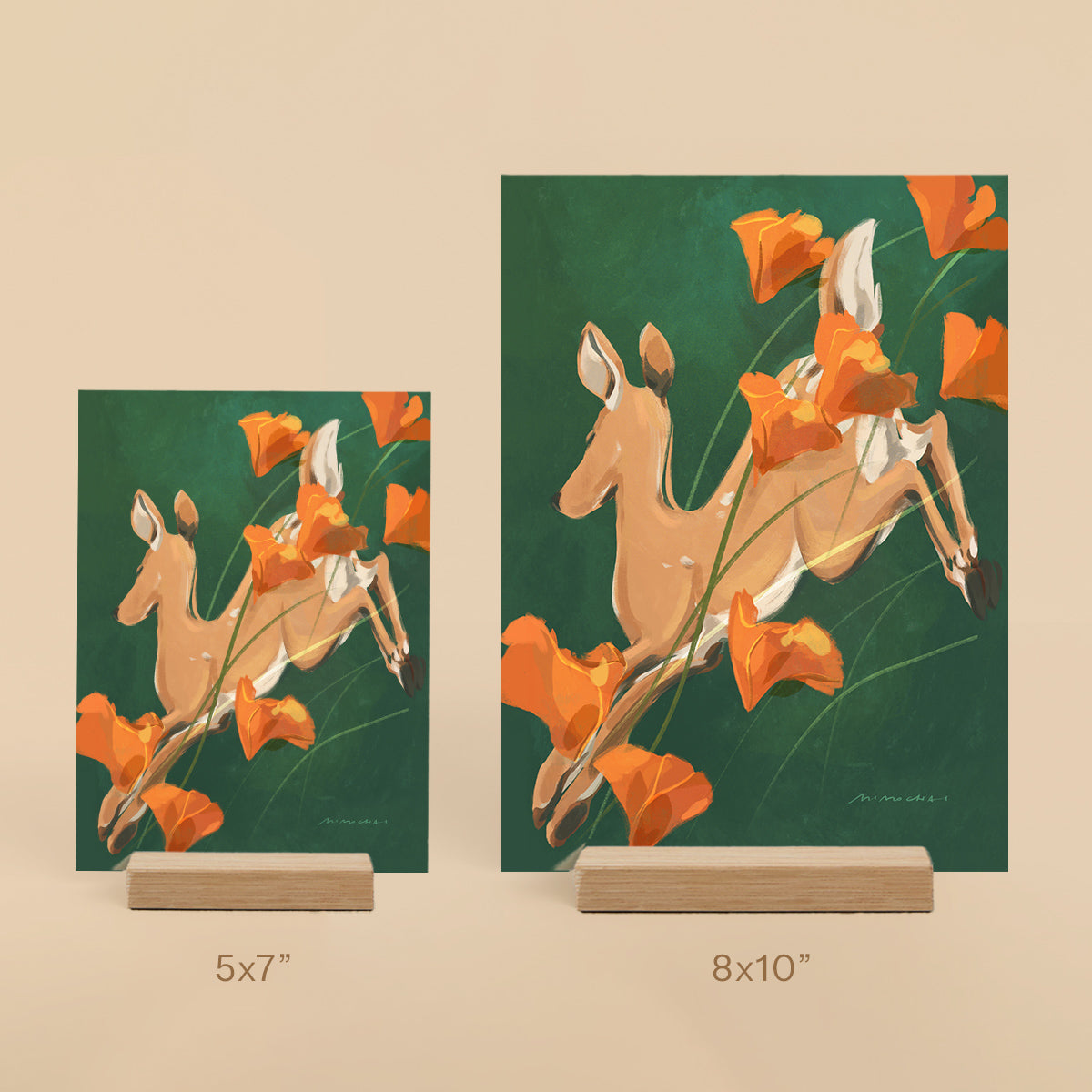 Two deer art prints with orange flowers on a green background, one 5x7" and one 8x10".