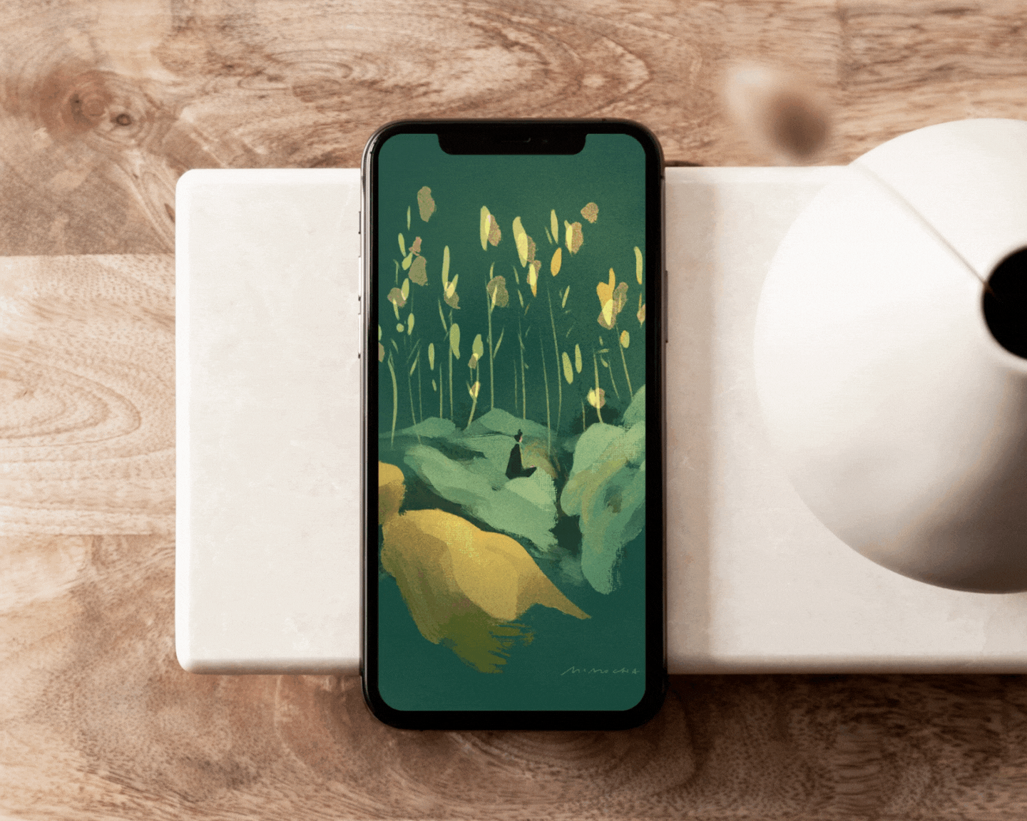 A phone with a gentle looping animated illustration on it