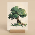 Art print of a tree with a person sitting under it on a beige background