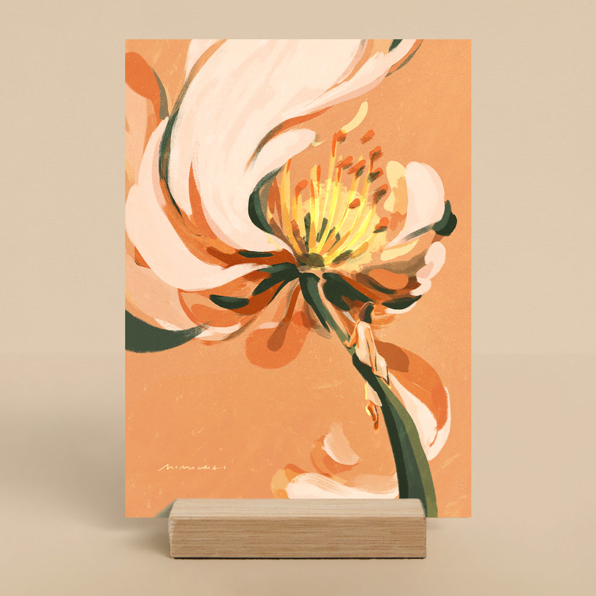 Orange floral art print on a stand against a beige background