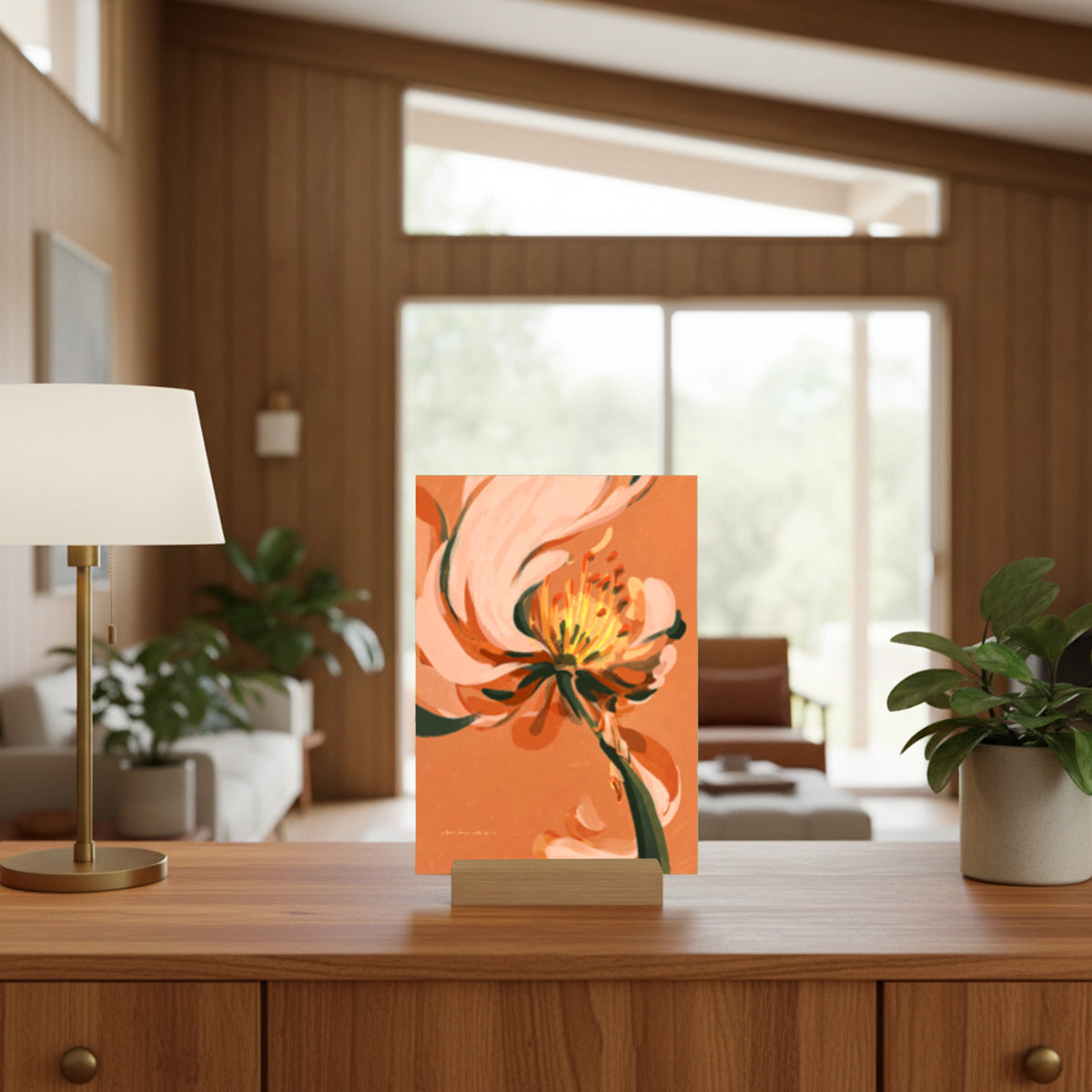 Decorative floral art piece on a wooden cabinet in a living room setting