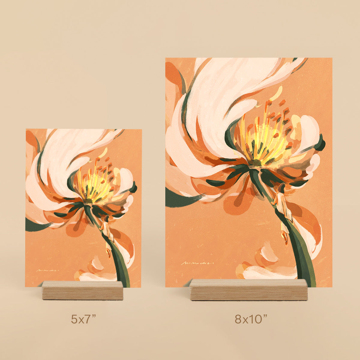 Two floral art prints on stands with dimensions 5x7" and 8x10" against a beige background.