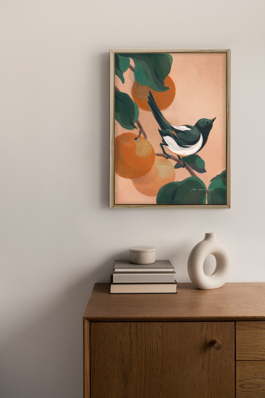 A framed canvas art print of a magpie sitting in a tree with orange fruits - zen art for home decor - Mimochai